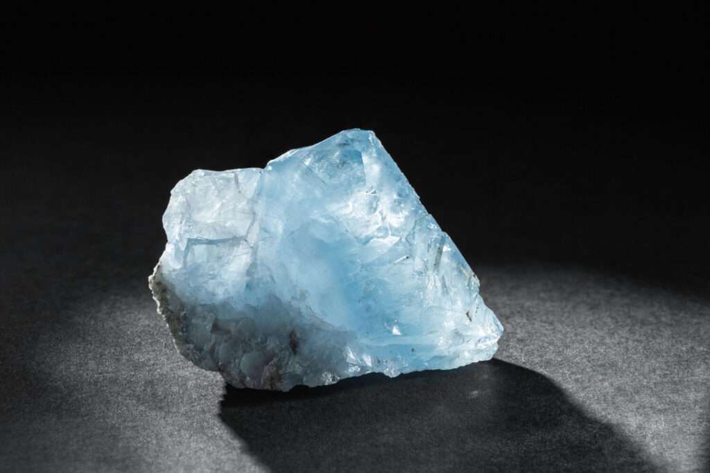 カルセドニーのイメージ写真です / Blue Celestine or Celestite Stone Mineral Gemstone Close Up on Dark Background. Natural Healing Gems for Collection or Spiritual Therapy.
